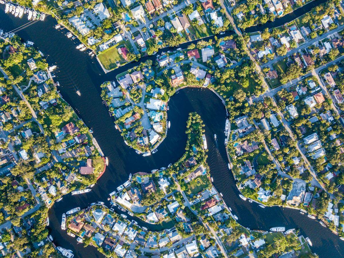 Aerial view of waterfront homes along a Fort Lauderdale river